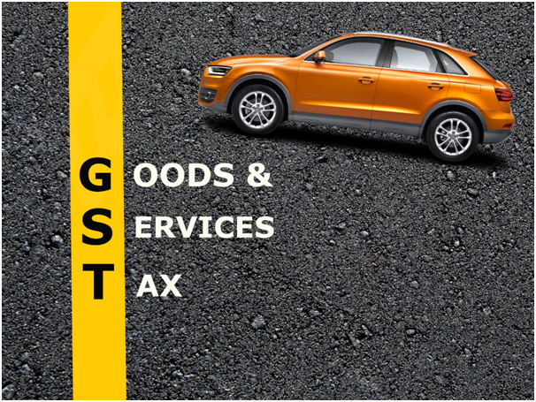 The Abbreviation Of GST With A Image Of Car In A Grey Background.